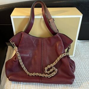 Michael Kors Astro bag Merlot Berry Color trimmed in light pink & gold hardware